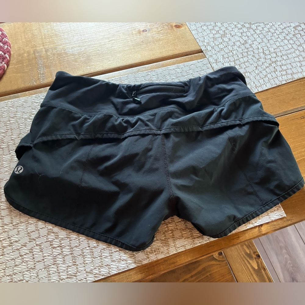 Black speed ups 2.5 in low rise. Size 4